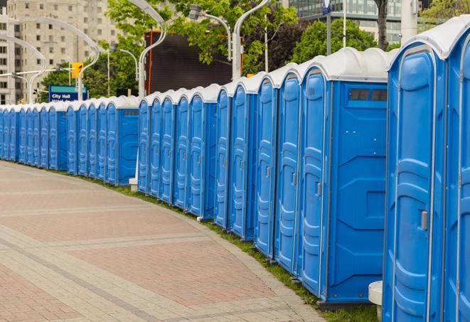 a row of portable restrooms at a fairground, offering visitors a clean and hassle-free experience in oontewah